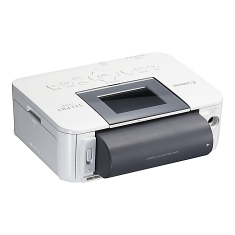 WeiÃŸer Canon Selphy Fotodrucker. Grauer Rahmen, dunkler Akku. KnÃ¶pfe oben. Schriftzug: Selphy CP1300.