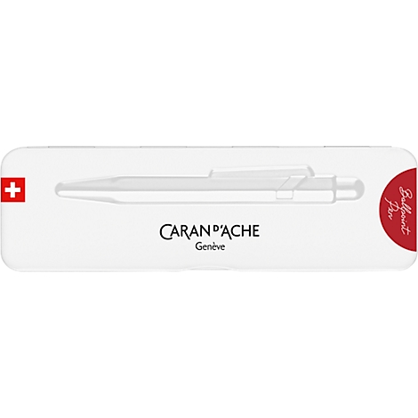 White pen holder with a Swiss cross. Caran d'Ache logo and ballpoint pen illustration.