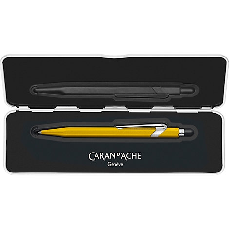 Opened pen case with a black and a golden pen. The brand name Caran d'Ache is printed.