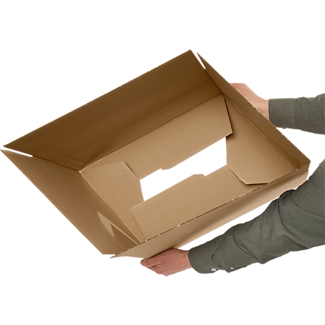 Person holding an open, brown shipping box. The box is viewed slightly from above, showing the inside.