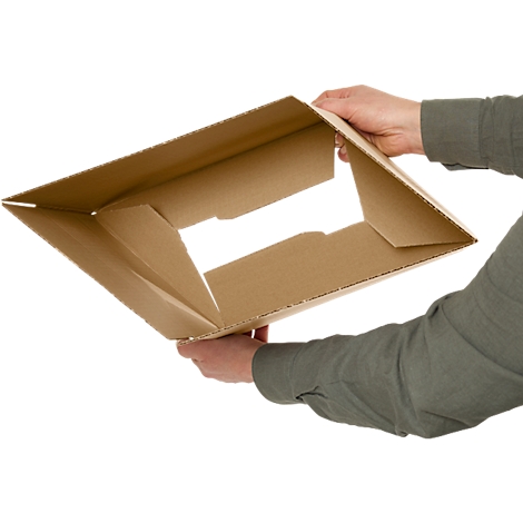 Person holding an open, brown cardboard box.