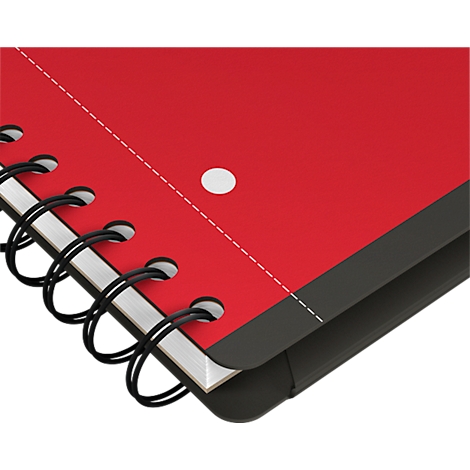 Gros plan sur un cahier à spirale rouge. Le papier est rouge, la reliure spirale est noire et la couverture également.