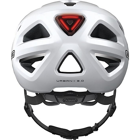Vue arrière d'un casque de vélo blanc avec un feu arrière rouge. Sangles noires et inscription "URBAN-I 3.0".