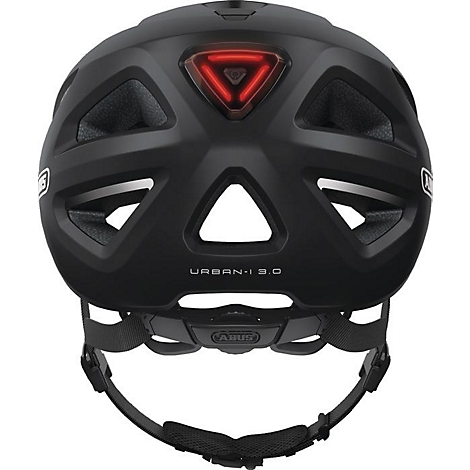 Casque de vélo noir, vue arrière, avec feu arrière rouge et l'inscription 'URBAN-I 3.0'.