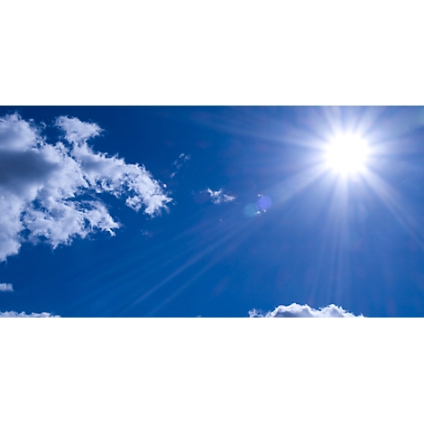 Bright sunshine in the blue sky with clouds.