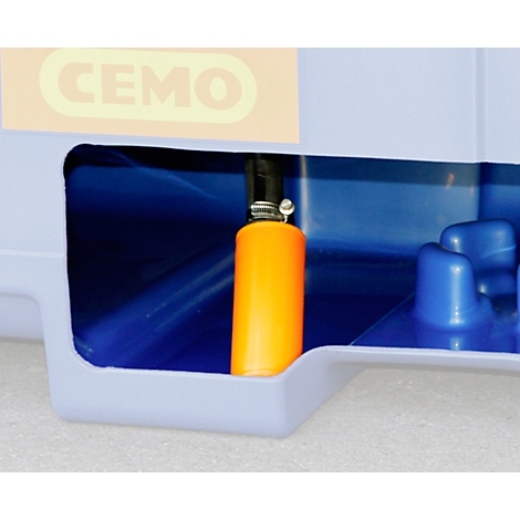 Detail shot: Yellow hose in blue tub, CEMO lettering at the top.