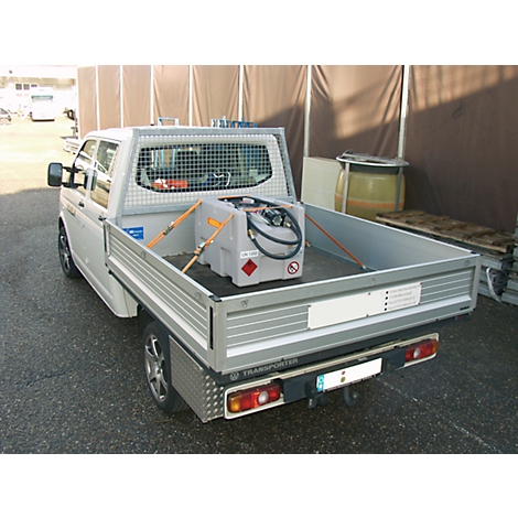 White VW Transporter with tank in the back. Tank is secured with straps. Metal grid separates the driver's cab.