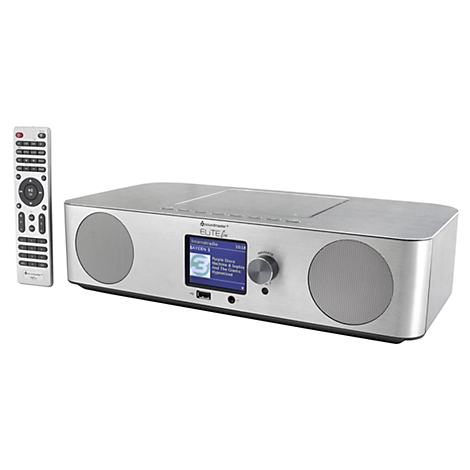 Radio argenté avec télécommande. Des informations peuvent être vues sur l'écran. Il y a un bouton sur la droite, en dessous se trouve un port USB.