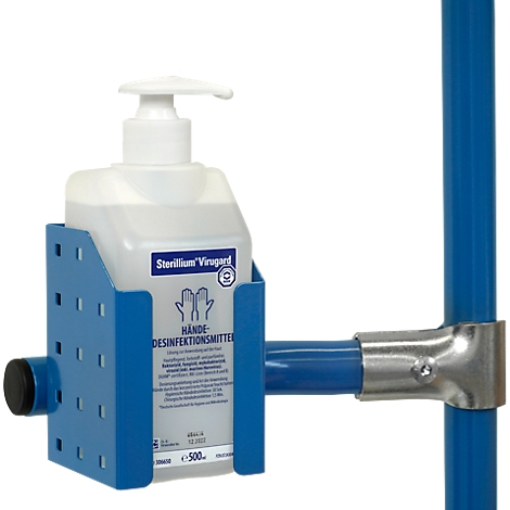 Un distributeur de désinfectant pour les mains étiqueté 'Sterillium Virugard' dans un support bleu, monté sur un tuyau bleu.