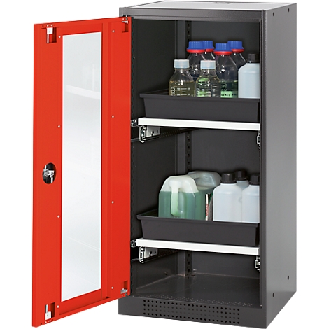 Cabinet with red door, opened. Inside: bottles and containers on black shelves.