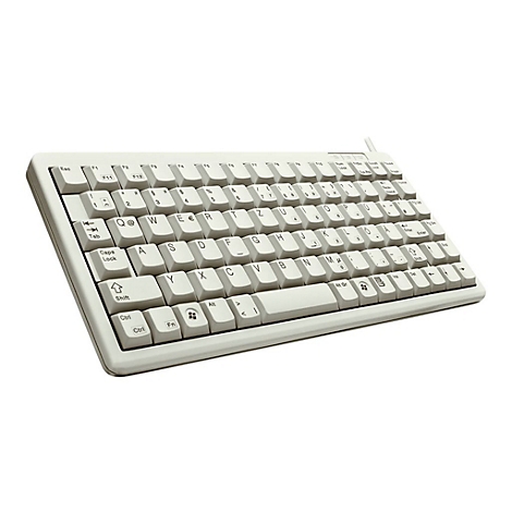Kompakte, beigefarbene Computertastatur mit deutschem Layout vor weißem Hintergrund.