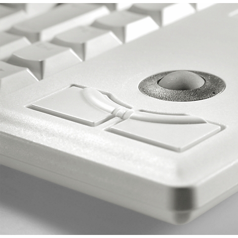 Close-up of a white keyboard with a trackball and buttons. The surface is bright and smooth.