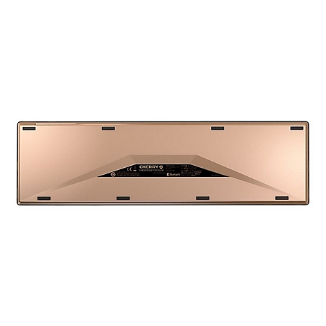 Die Unterseite einer goldenen Tastatur mit schwarzen Gummifüßen, dem Cherry-Logo und Bluetooth-Kennzeichen.
