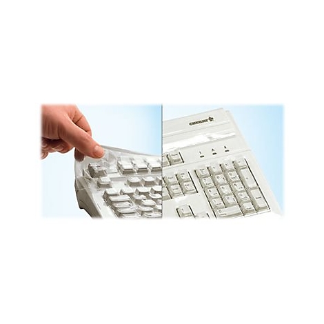 Gros plan d'une main soulevant une protection de clavier transparente reposant sur un clavier Cherry blanc.