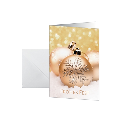 Christmas card with golden Christmas baubles on snow. Text: Frohes Fest.