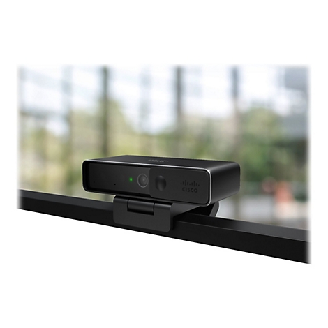 Schwarze Webcam mit Cisco-Logo, an Halterung befestigt. Grüne LED. Hintergrund unscharf.