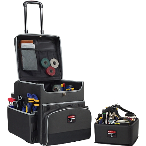 Black toolbox with wheels and telescopic handle. Open compartments, filled with tools, tape, and accessories. A separate toolbox next to it.