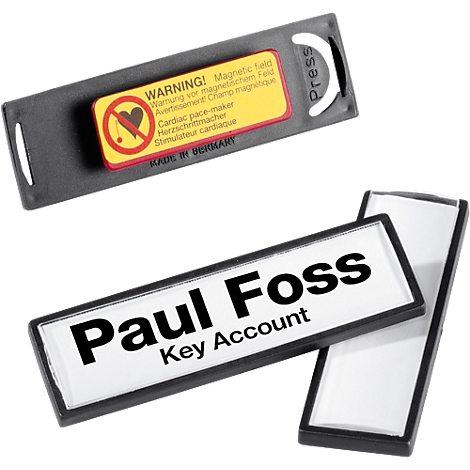 Name badges with a magnetic warning. One badge says 'Paul Foss, Key Account'.