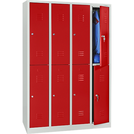 Red lockers, one door partially open. A blue jacket hangs inside one.