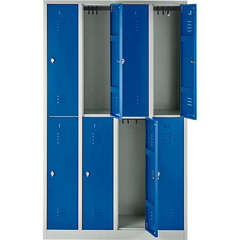 A locker cabinet with blue doors, some are open. Light walls, gray-beige interiors.