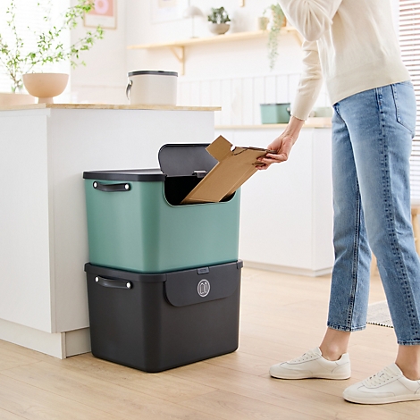 Boîte de rangement turquoise avec couvercle et poignée gris.