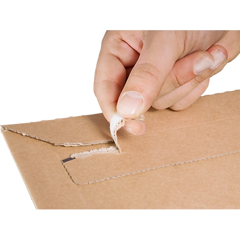 A hand is opening a brown envelope, with a white strip at the opening.