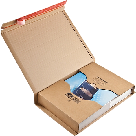 Opened brown shipping box with contents. A book is partially visible, showing an image of a bag.