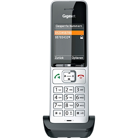 Téléphone sans fil Gigaset avec écran et clavier éclairés, numéros bloqués affichés.