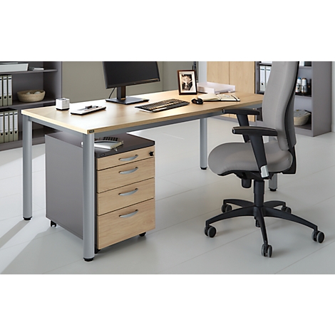 A modern desk with chair, drawer cabinet and computer. Wood and metal. Everything bright and clean.