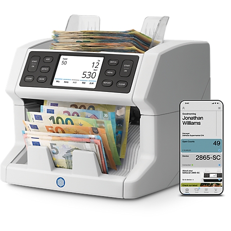 Machine de comptage de billets avec des billets en euros. Un petit écran affiche 530.
