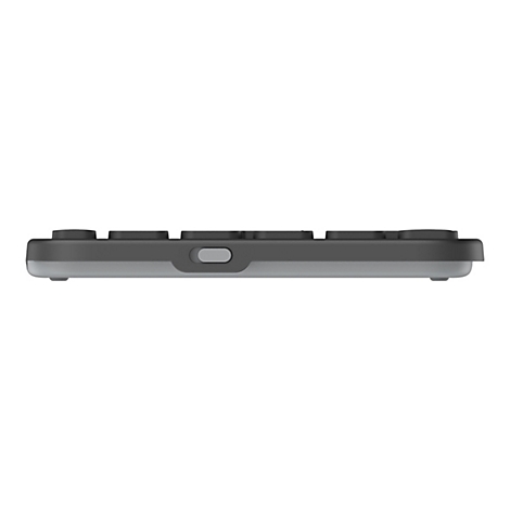 Seitenansicht einer flachen, grauen Tastatur mit schwarzen Tasten und einem kleinen Schalter an der Seite.