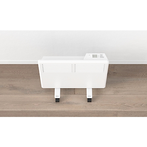 Witte kachel met wielen voor een witte muur. Op bruine parketvloer. Klein display.