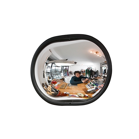 A round mirror lens with a black frame, reflecting an interior scene with a person at a counter.