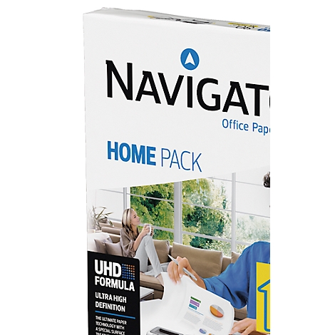 Paper pack with the Navigator lettering, Home Pack. In the background: woman drinking coffee, man printing diagrams.
