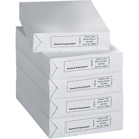 A stack of white paper packs with labels. The labels say "Standard Kopierpapier" in German.