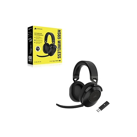 Schwarzes Corsair HS65 Wireless-Gaming-Headset mit Box und USB-Dongle. Das Headset liegt neben der Produktverpackung auf weißem Grund.