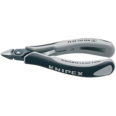 Une pince Knipex, grise et noire, pour les travaux de précision. Inscriptions sur les poignées : KNIPEX, Cu/hard Ø 0,2-1,3/max. 0,4mm, et plus.