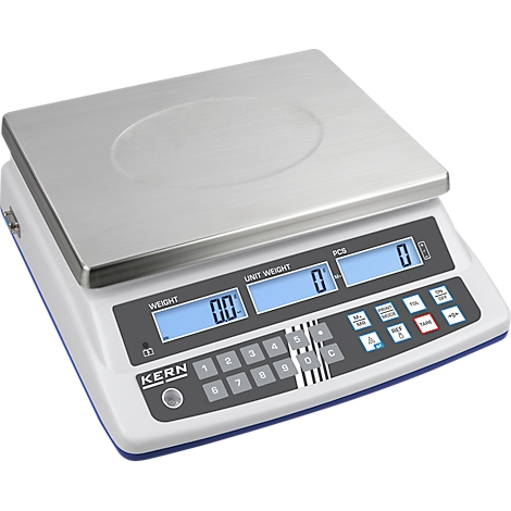 Digital scale with stainless steel plate and display. Buttons and display with values. Inscription: KERN, weight, piece.