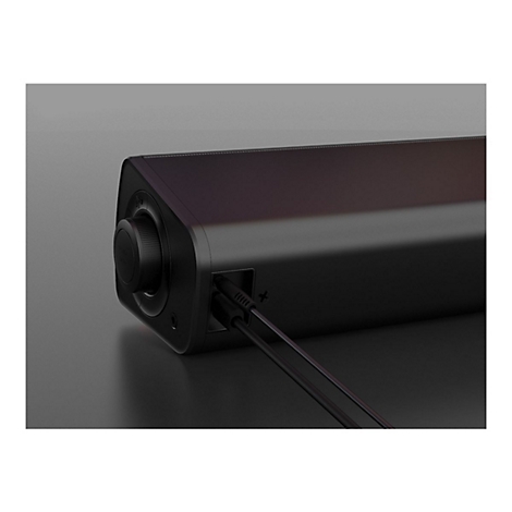 Nahaufnahme einer schwarzen Soundbar mit Drehknopf, Anschlüssen und Kabeln.