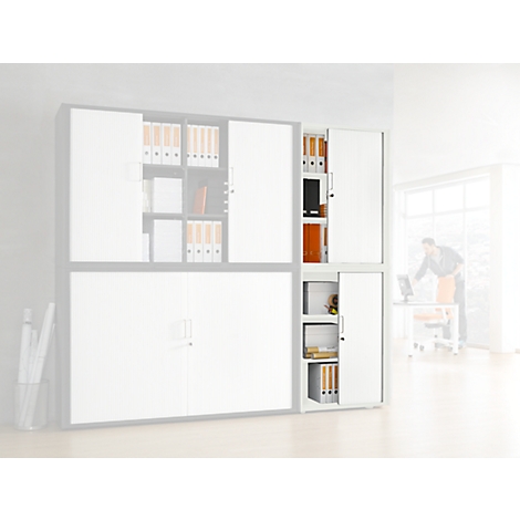 White office cabinet with file folders and open sliding door. A person is working in the background.