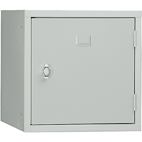 A grey metal cabinet with door, handle and hinges. A recess is visible on top.