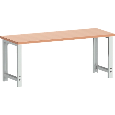 A light-colored work table, with a light brown table top and gray metal frame.