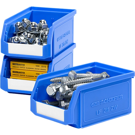 Cajas de almacenamiento azules con tuercas, tornillos y notas amarillas. Inscripción: SSI Schäfer LF 211 ZW.