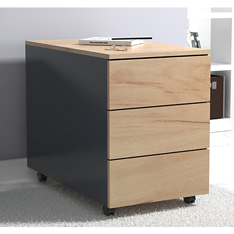 A gray rolling cabinet with three drawers. A book, glasses and a pen are on top.