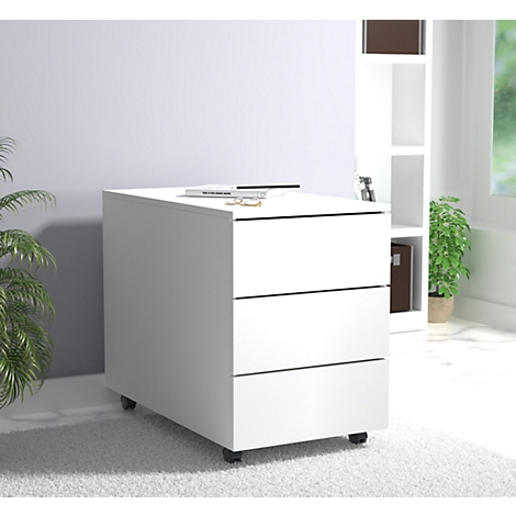 White rolling file cabinet with three drawers, on which rests a book, glasses, and other items. A bookcase can be seen behind it.