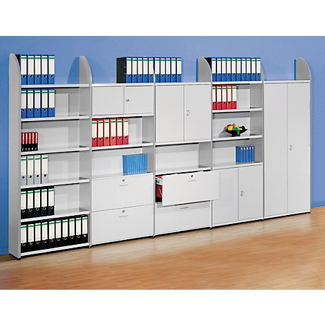 White office shelving unit with binders, drawers, and cabinets. Binders in various colors, set against a blue background.