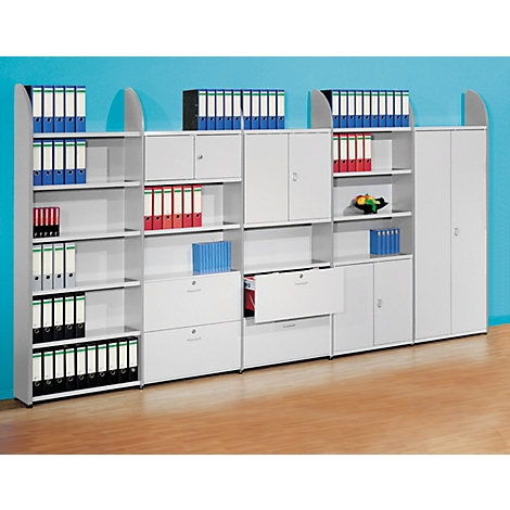 White office furniture with open shelves, cabinets and drawers filled with files. On a blue background.