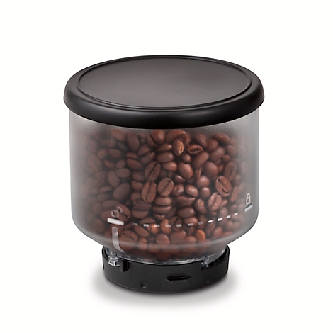 Grains de café dans un récipient noir. Le récipient transparent est rempli de grains. Couvercle noir. Des marques sont apposées sur le récipient.