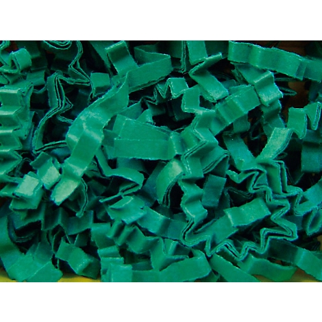 Close-up of crumpled, green paper strips. They are creased and lie haphazardly on top of each other.