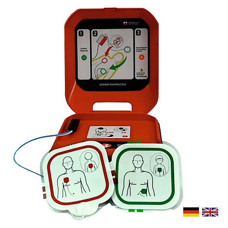 Roter Defibrillator geöffnet mit Elektroden, Anleitung und Flaggen.